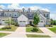 Charming townhomes feature attached garages, manicured lawns, and neutral color schemes at 13221 Gadwal Pintail Dr, Charlotte, NC 28262