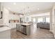 Open kitchen featuring stainless appliances, island with sink, and hardwood floors at 13221 Gadwal Pintail Dr, Charlotte, NC 28262