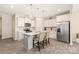 Modern kitchen features stainless steel appliances, a center island, and pendant lighting at 13221 Gadwal Pintail Dr, Charlotte, NC 28262