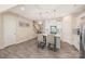 Kitchen featuring stainless appliances, island with seating, and hardwood floors at 13221 Gadwal Pintail Dr, Charlotte, NC 28262