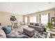 Spacious living room boasts hardwood floors, plenty of natural light, and stylish furnishings at 13221 Gadwal Pintail Dr, Charlotte, NC 28262