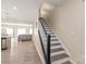 Bright entryway with a staircase that leads to the upper level of the home at 13221 Gadwal Pintail Dr, Charlotte, NC 28262