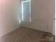 A bedroom with neutral walls and carpet flooring, a single window, and a blank canvas for personalization at 1381 Steven Dr, Salisbury, NC 28147
