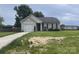 Charming single-story home with attached garage and well-maintained lawn with some hay spread out on the front yard at 1381 Steven Dr, Salisbury, NC 28147