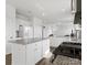 Open concept kitchen featuring granite countertops, white cabinets, and stainless appliances at 1433 Harleston St, Indian Trail, NC 28079