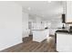 Spacious kitchen with white cabinetry, granite countertops, stainless appliances, and an island with breakfast bar seating at 1433 Harleston St, Indian Trail, NC 28079