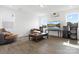 Cozy living room with hardwood floors, neutral paint, a comfortable seating area, and entertainment center at 1433 Harleston St, Indian Trail, NC 28079