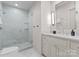 Elegant bathroom showcasing a marble walk-in shower and vanity with a large mirror and modern fixtures at 1550 Queens W Rd, Charlotte, NC 28207