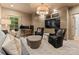 Cozy bonus room featuring built in shelving and a large television at 1550 Queens W Rd, Charlotte, NC 28207