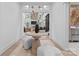 Inviting foyer featuring a stylish round table with accent decor and a view into the bright, open living room at 1550 Queens W Rd, Charlotte, NC 28207