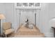 Welcoming foyer with stylish decor, a round table, and plush seating, creating a warm and inviting entrance at 1550 Queens W Rd, Charlotte, NC 28207