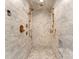 Elegant shower with herringbone tile, dual shower heads, and built-in niches for storage at 1550 Queens W Rd, Charlotte, NC 28207