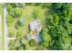 Stunning aerial view of private home with a pool surrounded by lush green landscape and mature trees at 1567 Jennings Rd, Statesville, NC 28625
