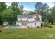 Beautiful backyard featuring a sparkling swimming pool and well-manicured lawn, perfect for outdoor enjoyment and relaxation at 1567 Jennings Rd, Statesville, NC 28625