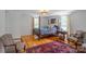 Bright bedroom with four-poster bed, wood floors, area rug, and abundant natural light at 1567 Jennings Rd, Statesville, NC 28625