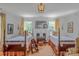Bedroom featuring two beds, a central fireplace, and matching decor for a symmetrical look at 1567 Jennings Rd, Statesville, NC 28625