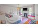 Comfortable bedroom featuring a fireplace, television, and pink accents throughout the space at 1567 Jennings Rd, Statesville, NC 28625