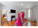 Bedroom with a fireplace, television, zebra print rug, and walk through to another room at 1567 Jennings Rd, Statesville, NC 28625