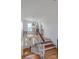 Hallway with hardwood floors, white walls, and staircase leading to the upper and lower levels at 1567 Jennings Rd, Statesville, NC 28625