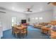 Spacious living room with a ceiling fan, dining area, and comfortable seating arrangement at 1567 Jennings Rd, Statesville, NC 28625