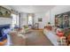 Bright living room with stylish decor, hardwood floors, and ample seating, creating a cozy and elegant atmosphere at 1567 Jennings Rd, Statesville, NC 28625