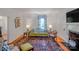 Charming living room with colorful rug, comfortable seating, and natural light, creating a cozy and inviting space at 1567 Jennings Rd, Statesville, NC 28625
