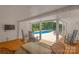 Covered patio area with rocking chairs and a view of the backyard pool at 1567 Jennings Rd, Statesville, NC 28625