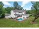 Aerial view of a home's fenced in pool surrounded by a lush green lawn at 1567 Jennings Rd, Statesville, NC 28625