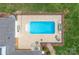 Aerial view of a private, fenced pool with lounge chairs and an expansive deck area for entertaining at 1567 Jennings Rd, Statesville, NC 28625