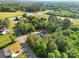 Aerial view of a home surrounded by lush greenery and mature trees at 1811 Continental Dr, Albemarle, NC 28001