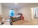 Cozy bedroom with a sunny window, neutral walls, and carpeted floor at 1811 Continental Dr, Albemarle, NC 28001