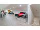 Spacious bonus room with neutral walls, light laminate floor and two desks at 1811 Continental Dr, Albemarle, NC 28001
