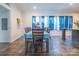 Bright dining area with blue-toned curtains, showcasing a spacious layout with wood-look flooring at 1811 Continental Dr, Albemarle, NC 28001