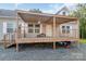 Covered porch with hanging flower basket and stairs at 1811 Continental Dr, Albemarle, NC 28001