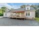 Beautiful home featuring a covered deck with stairs and white-trimmed windows at 1811 Continental Dr, Albemarle, NC 28001