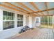 Inviting covered front porch featuring wood flooring and space for seating and decor at 1811 Continental Dr, Albemarle, NC 28001