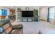 Bright and spacious living room with display shelving and a comfortable recliner at 1811 Continental Dr, Albemarle, NC 28001