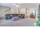 Spacious living room featuring neutral carpet and stairs to the second floor at 1811 Continental Dr, Albemarle, NC 28001