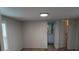 An open bedroom with wood floors and a view into the bathroom creates a comfortable space at 189 6Th Ave, New London, NC 28127