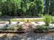 Tranquil garden with stone benches and pathway, perfect for relaxation and outdoor enjoyment at 189 6Th Ave, New London, NC 28127