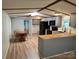Open-concept kitchen and dining area with modern appliances, countertops, and wood-style flooring at 189 6Th Ave, New London, NC 28127
