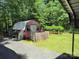 Quaint shed in a lush backyard setting with garden at 189 6Th Ave, New London, NC 28127