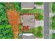Bird's-eye view of a brown-roofed home with manicured lawns and surrounding green trees at 1919 Madeira Cir, Waxhaw, NC 28173