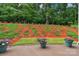 Landscaped backyard features mulched hillsides and potted plants at 1919 Madeira Cir, Waxhaw, NC 28173