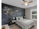 Bright bedroom featuring a chalkboard wall, ceiling fan, and natural light at 1919 Madeira Cir, Waxhaw, NC 28173