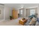 Spacious bonus room with natural lighting, ceiling fan, and carpeted floors at 1919 Madeira Cir, Waxhaw, NC 28173