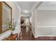 Elegant foyer with hardwood floors, decorative mirror, and views of the living spaces at 1919 Madeira Cir, Waxhaw, NC 28173