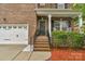 Inviting front porch and brick staircase, along with classic exterior details at 1919 Madeira Cir, Waxhaw, NC 28173