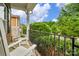 Charming front porch with rocking chairs, black iron railing and lovely landscaping at 1919 Madeira Cir, Waxhaw, NC 28173