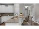 Bright kitchen featuring granite countertops, stainless steel appliances, and white cabinetry at 1919 Madeira Cir, Waxhaw, NC 28173